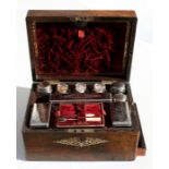 A Victorian rosewood vanity box inlaid with mother of pearl, the fitted interior with lift-out tray,