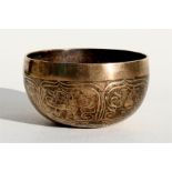 A polished bronzed Tibetan singing bowl, 13cm (5ins) diameter.