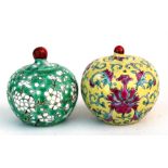 Two Chinese miniature bulbous vases and covers, green ground and yellow ground, 5cm (2ins) high.