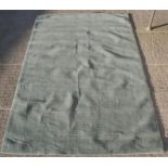 A John Lewis hand made woollen rug, duck egg blue 300 by 200cm (118 by 78ins).