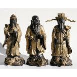 A group of three Chinese gilded bronze figures 36cm (14ins) high.