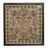 A large 19th century sampler depicting flowers, birds, trees and animals by Margret Harries,