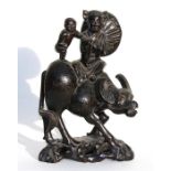 A Chinese hardwood group of figures on a buffalo, with white metal wire work decoration. 30cm (