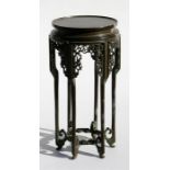 A tall Chinese bronze vase stand, standing on six legs with four character impressed mark to the
