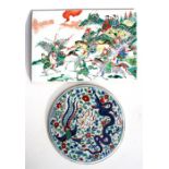 A Chinese famille rose plaque, decorated with warriors in enamel colours, 38 by 25.5cm (15 by 10ins)