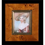 A portrait miniature on ivory depicting a young girl wearing a bonnet, mounted in a modern frame,