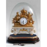 A 19th century French gilt metal mantle clock, the white enamel dial with Roman numerals, flanked by