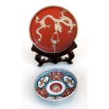 A Chinese Yixing pottery white metal mounted shallow dish decorated with a dragon and flaming pearl,