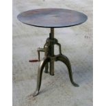 An industrial style circular steel crank table on tripod base, 77cm (30.5ins) diameter.