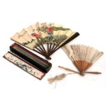 A Chinese silk embroidered sandalwood fan in lacquered wooden box; together with a Chinese bamboo