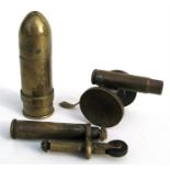 Two WWI Trench Art lighters, the largest 8cm (3.25ins) high, and a cannon.