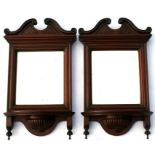 A pair of late 19th century walnut mirror backed wall shelves, 30cm (12ins) wide.