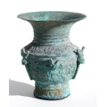 An archaic style Chinese bronze vase decorated with mythical beasts, 21cm (8.25ins) high.