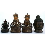 Two bronze Buddha seated in meditation, 14cm (5.5ins) high; together with another similar smaller,