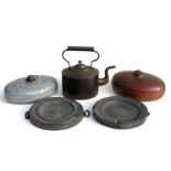 A copper teapot, two 19th century pewter plate warmers and other items (5).