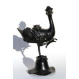 A Chinese Ming bronze censer in the form of a duck, 34cm (13.5ins) high.