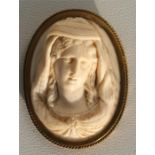 A 19th century oval ivory cameo brooch, deeply carved in the form of a young lady, 5.5cm (2.1ins) .