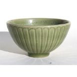 A Chinese celadon glazed fluted bowl, 15cm (6ins) diameter. Condition Report good overall condition