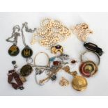 A quantity of silver necklaces and pendants including a silver mounted enamelled Fijian dollar