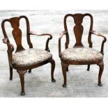A pair of Georgian design walnut armchairs with shaped back splat and drop-in upholstered seats,