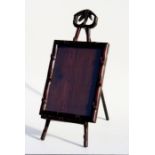 A Chinese Hongmu picture frame on easel stand with carved bamboo decoration, 27 by 35cm (10.5 by