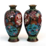 A pair of Japanese miniature cloisonne vases decorated with flowers, 9cm (3.5ins) high. Condition