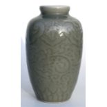 A 20th century Chinese celadon glazed vase, 17cm (6.75ins) high.