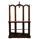 A large Victorian Gothic mirror backed hall stand with three arched panels, 125cm (49ins) wide.