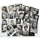 A quantity of early 20th century film or entertainment signed photographs and postcards, including