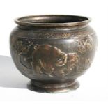 A Chinese bronze jardiniere decorated in relief with elephants and prunus, 33cm (13ins) diameter.