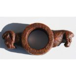 An archaic style Chinese carved jade pole fitting carved with a rams head and a horse head, 20cm (