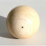 An early 20th century ivory billiard ball, 4.5cm (1.75ins) diameter (weight 95g).
