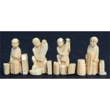 Four late 19th century Japanese carved ivory figures in the form of workmen, the largest 6cm (2.