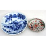 A Japanese blue & white charger, the decoration depicting a mountainous village scene, six character