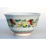A Chinese famille rose bowl, decorated with fruit and bats, and having a blue six character mark