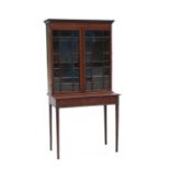 An Edwardian mahogany inlaid bookcase on stand, the pair of glazed doors enclosing shelved