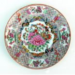 A Chinese Canton famille rose plate, decorated with birds, butterflies and flowers in enamel