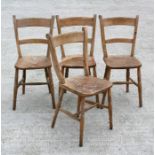A set of four stripped elm and beech Oxford kitchen chairs.