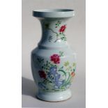 A large 18th century famille rose vase, decorated with flowers in enamel colours, 41cm (16ins) high.