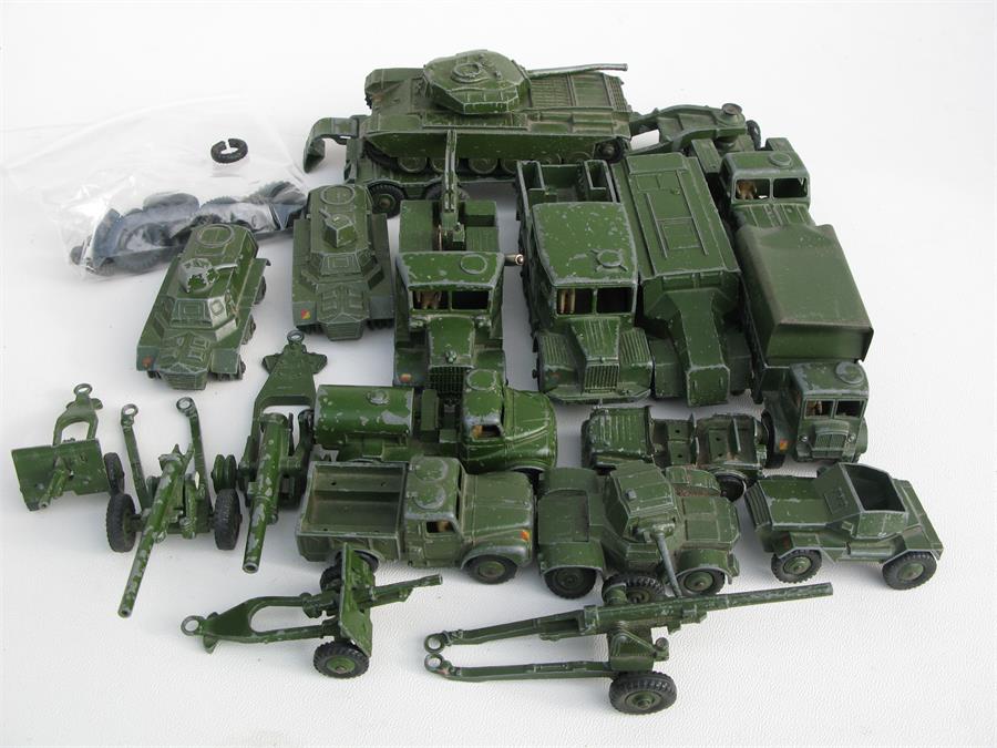 A quantity of Dinky Military vehicles including armored command vehicle and field guns.