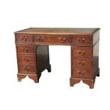 A reproduction mahogany twin pedestal desk with leather inset top, 120cm (47ins) wide.