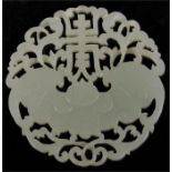 A Chinese white jade roundel decorated with a bat and foliate scrolls, and Shou (long life)