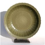 A large Chinese celadon glazed fluted bowl, 42cm (16.5ins) diameter. Condition Report Very good