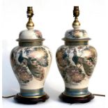 A pair of 20th century Japanese Satsuma vase table lamps, decorated with flowers on a cream ground