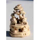 A 19th century Chinese ivory group depicting Scholars playing Go, 6.5cm high. 39.3g Condition Report
