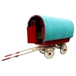 A vintage bowtop gypsy caravan, the bowtop canvas over a hand painted Wright & Co, Belton,