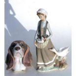 A Lladro group, a girl with geese, 31cm (12ins) high; together with a Lladro Basset Hound head, 15cm