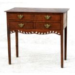An early 19th century Welsh oak side table or lowboy, the rectangular top above a single long drawer