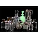 A collection of silver topped and other scent bottles, including hair tidy's and hat pin tubes (