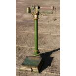 An early 20th century set of Doctor’s green painted upright cast iron scales by Medical Supply
